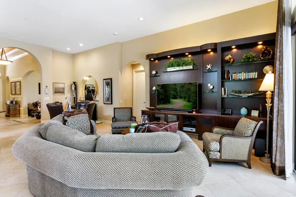 a living room with furniture and a flat screen tv
