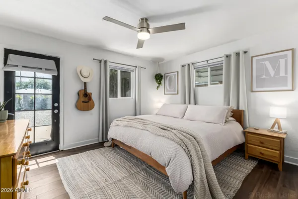 a bedroom with a large bed and a window