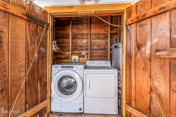 a view of a utility room with dryer and washer