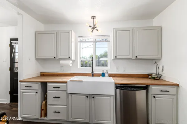 a kitchen with appliances cabinets and a window