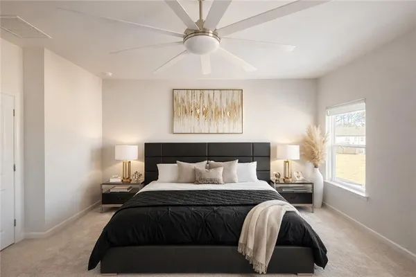 a bedroom with a bed and a window