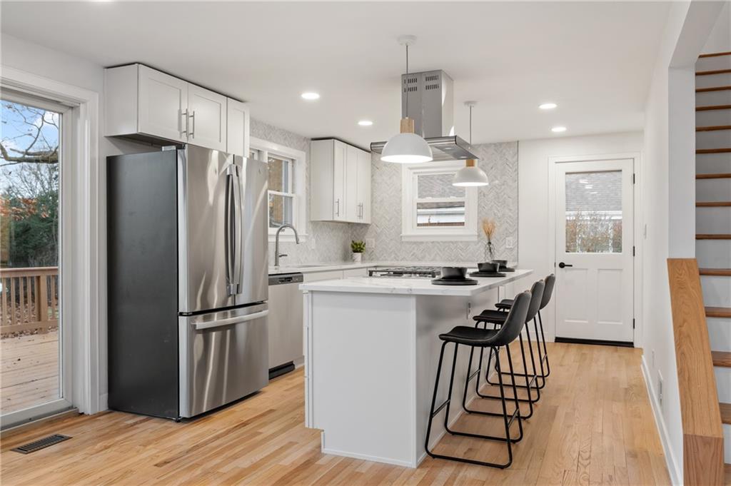 107 Marlboro Road Pittsburgh, PA 15238 - Photo 11 of 45 a kitchen with kitchen island white cabinets and stainless steel appliances