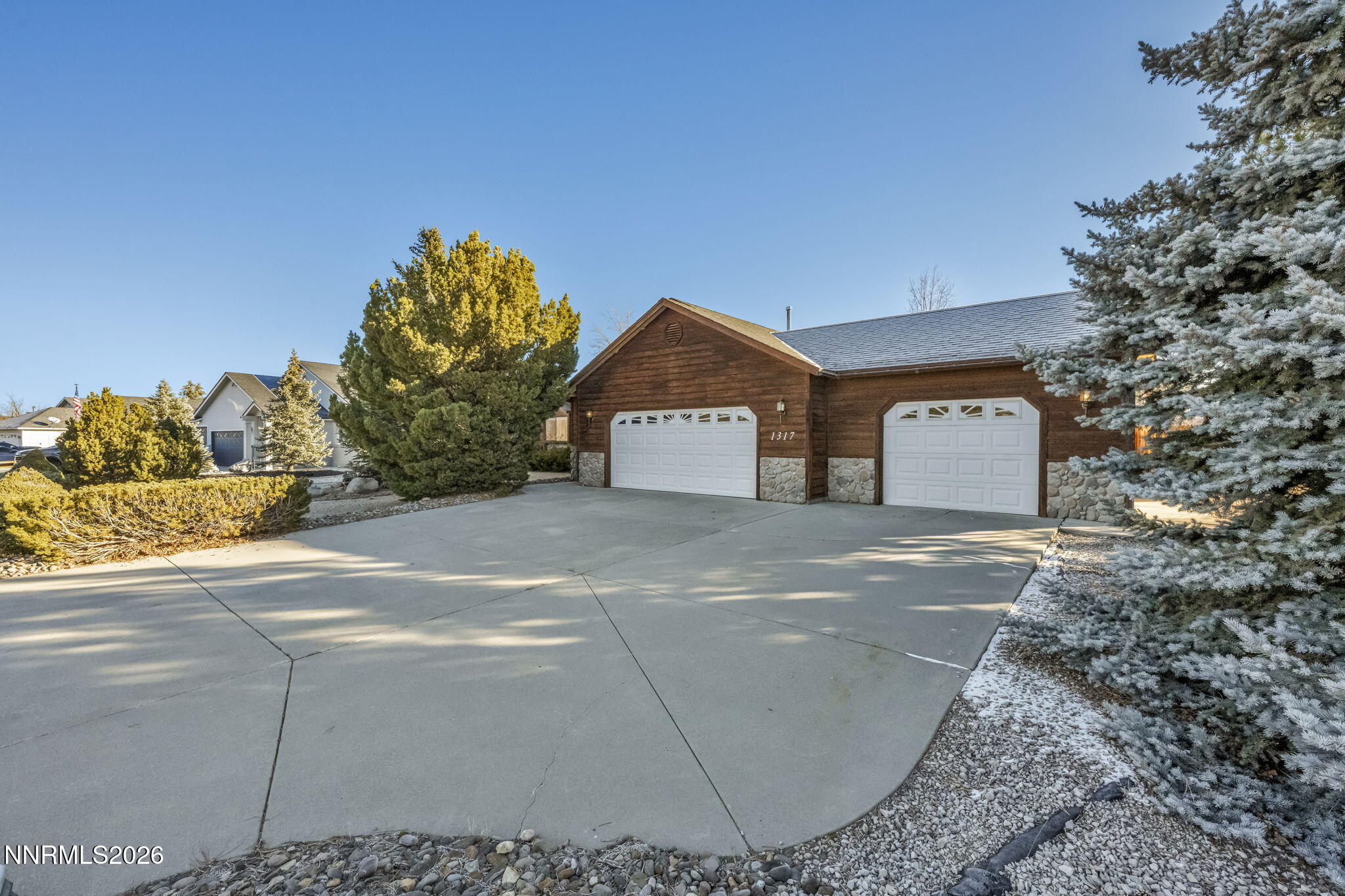 1317 Bridle Way Minden, NV 89423 - Photo 2 of 57 a view of a house with a yard and garage