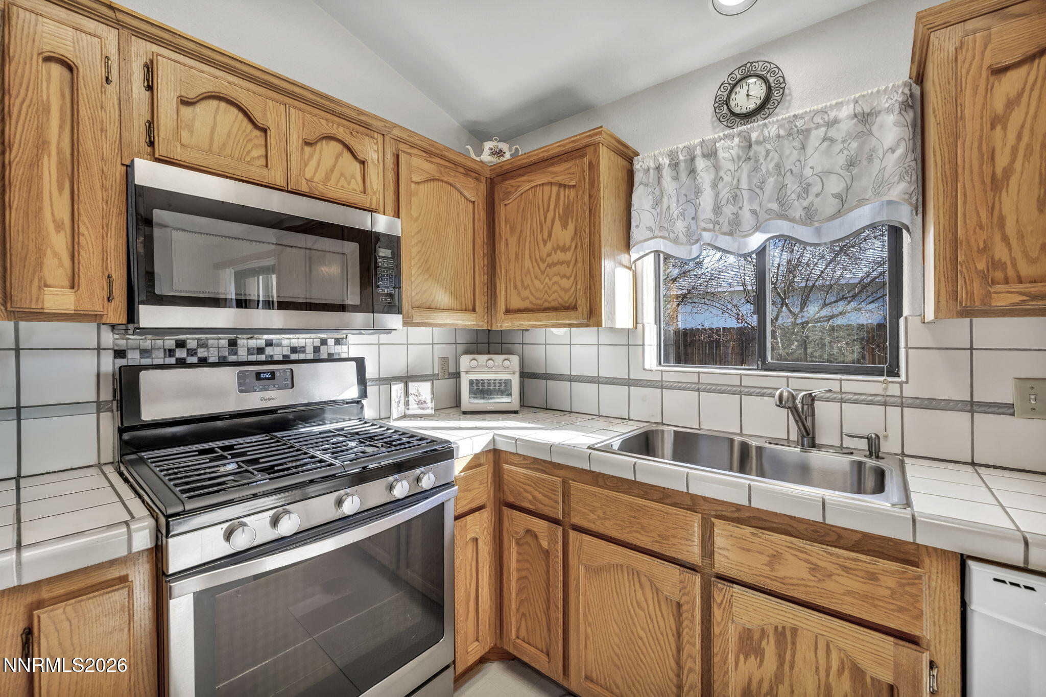 1317 Bridle Way Minden, NV 89423 - Photo 28 of 57 a kitchen with cabinets appliances and a sink