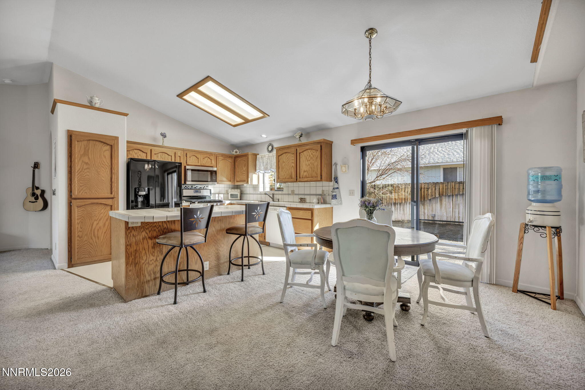1317 Bridle Way Minden, NV 89423 - Photo 30 of 57 a dining room with furniture and window