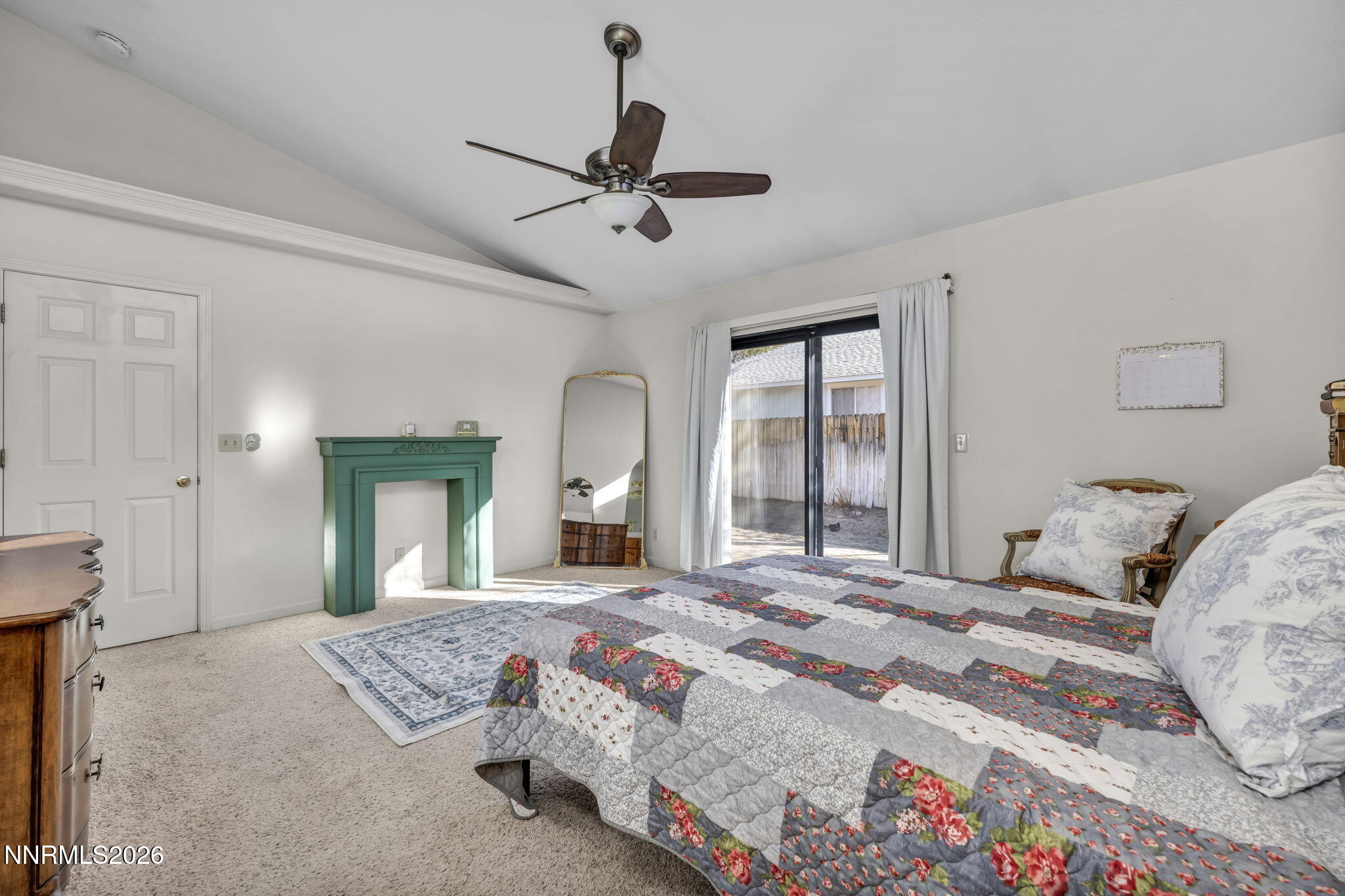 1317 Bridle Way Minden, NV 89423 - Photo 34 of 57 a bedroom with a large bed and a chandelier