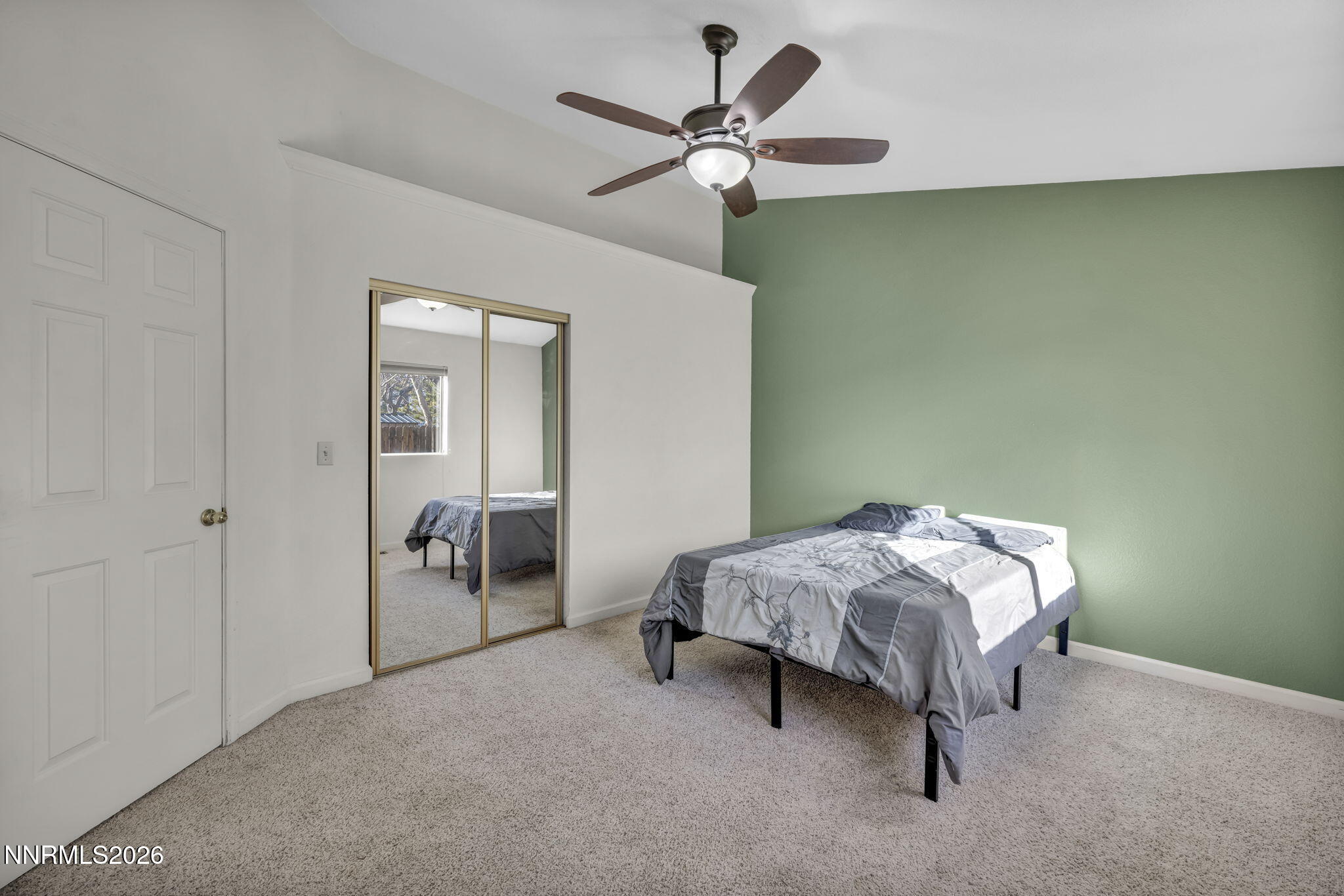 1317 Bridle Way Minden, NV 89423 - Photo 36 of 57 a bedroom with a bed and a ceiling fan