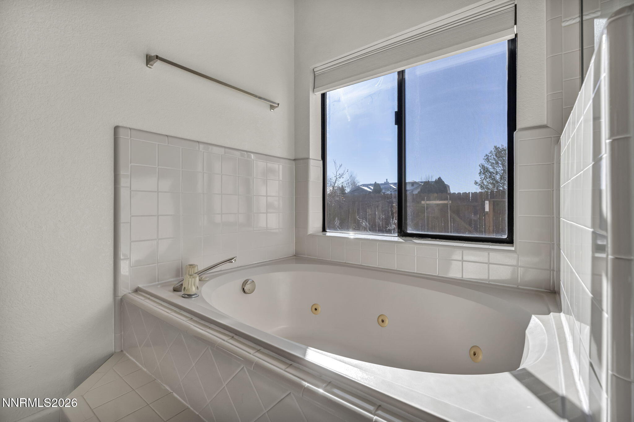 1317 Bridle Way Minden, NV 89423 - Photo 44 of 57 a bathroom with a bathtub and a shower