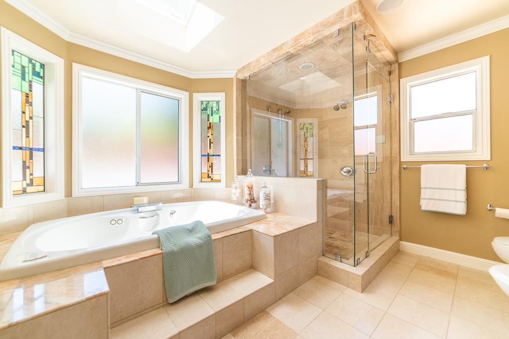 1952 Fallen Leaf Lane Los Altos, CA 94024 - Photo 12 of 23 a spacious bathroom with a tub sink shower and mirror