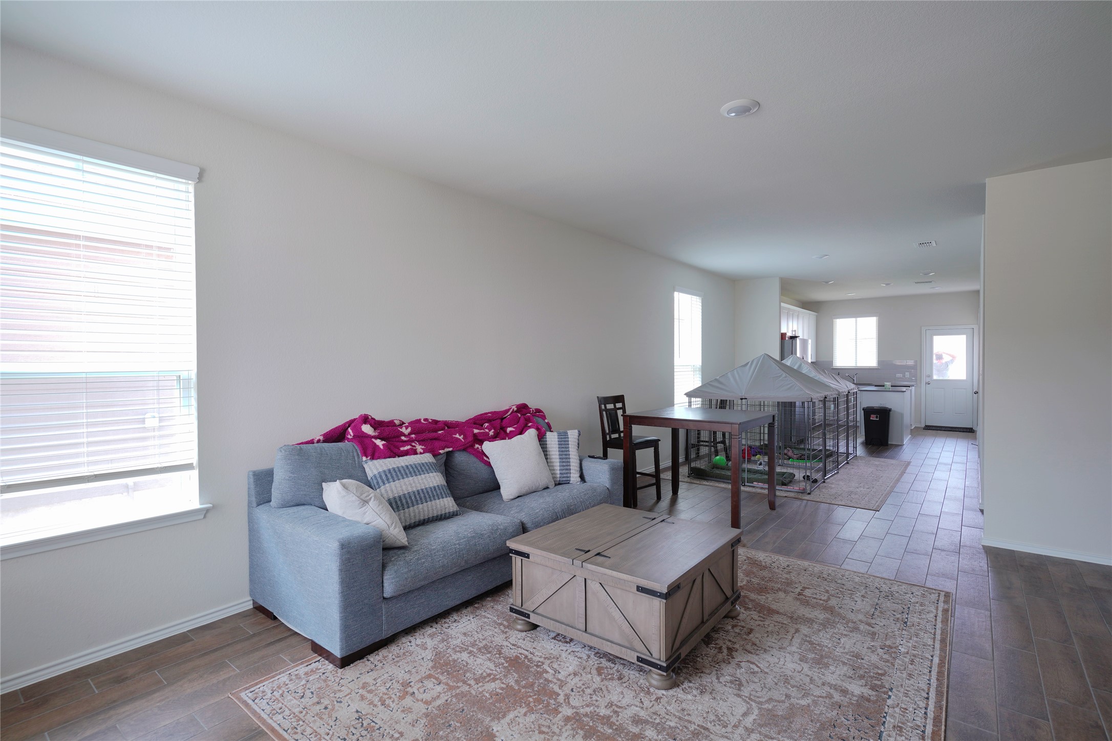 545 Tree Nut Loop Buda, TX 78610 - Photo 19 of 19 An open floorplan seamlessly connects the living space to the dining and kitchen areas.