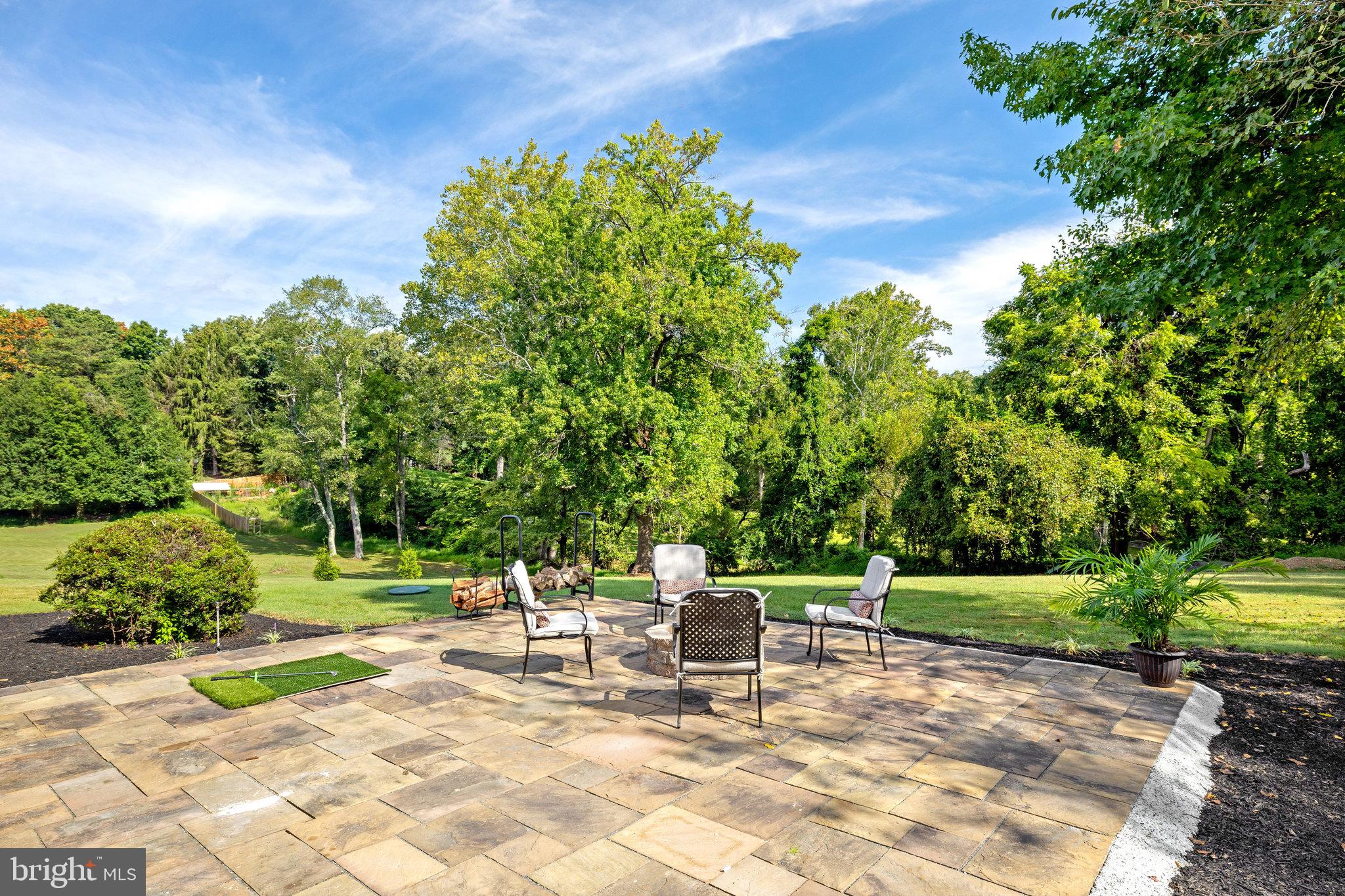 11410 Waples Mill Road Oakton, VA 22124 - Photo 55 of 62 Serene patio with lush green backdrop.