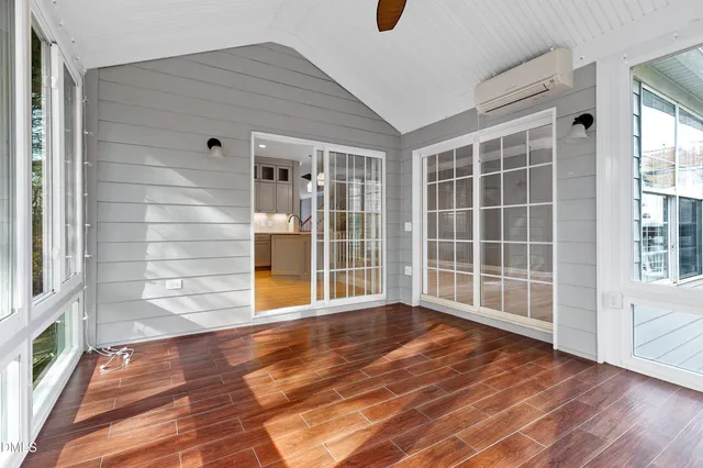 a view of empty room with windows