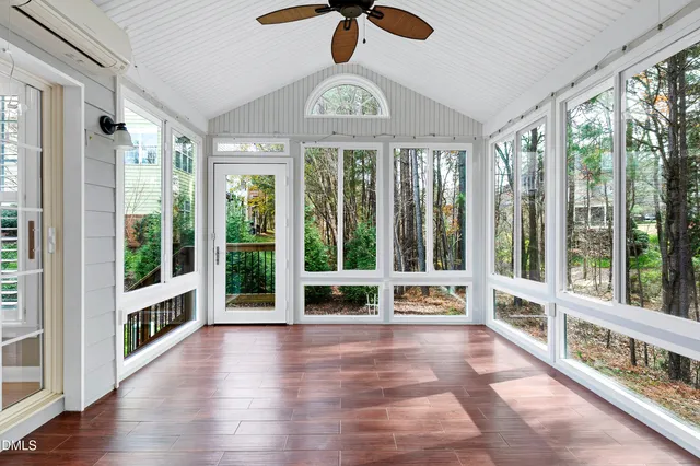 a view of an entryway with wooden floor