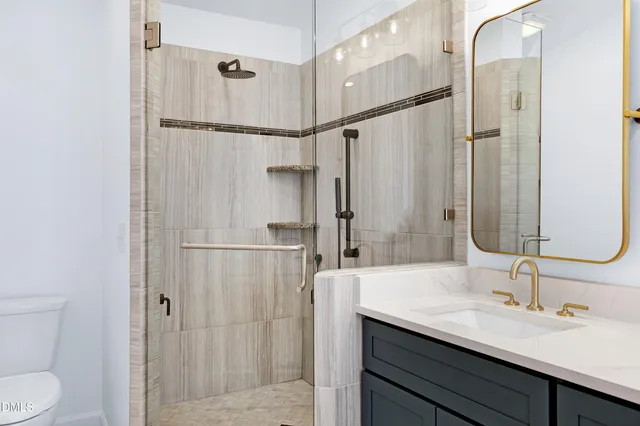 a bathroom with a double vanity sink mirror and shower