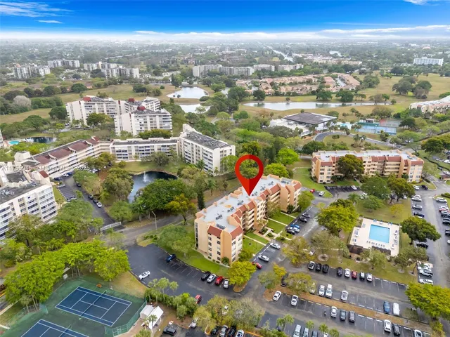 an aerial view of residential building and parking space