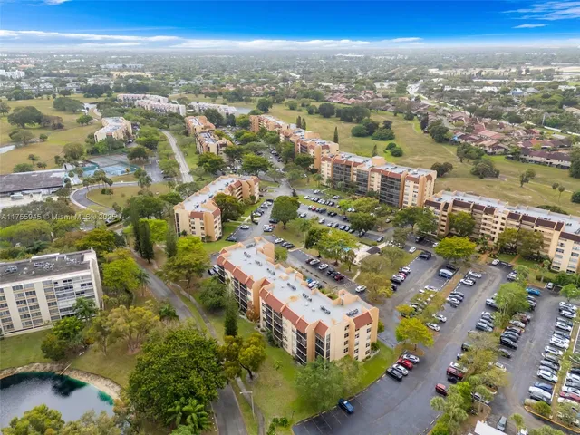 an aerial view of a house with a swimming pool yard and outdoor seating