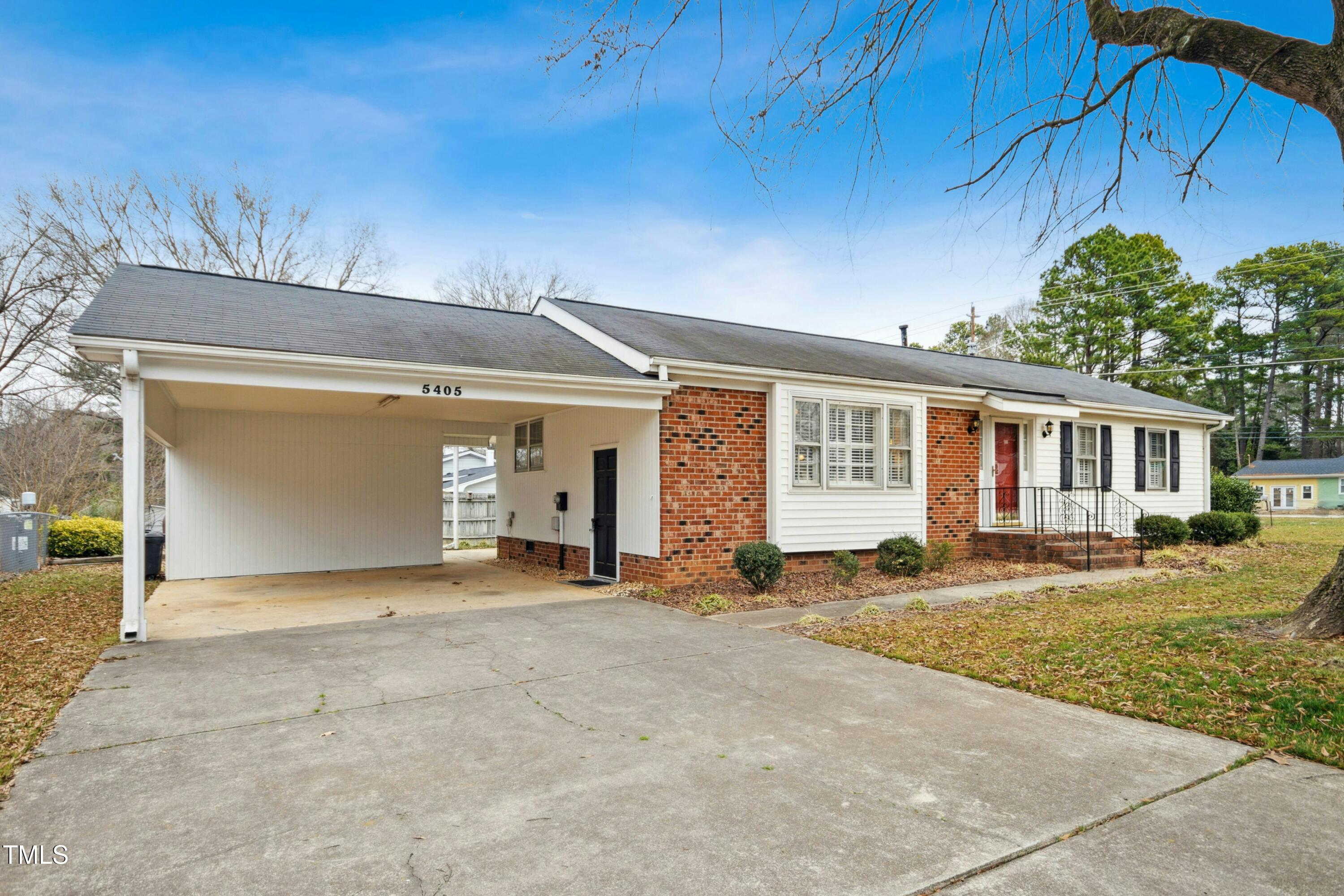 a front view of a house with a outdoor space