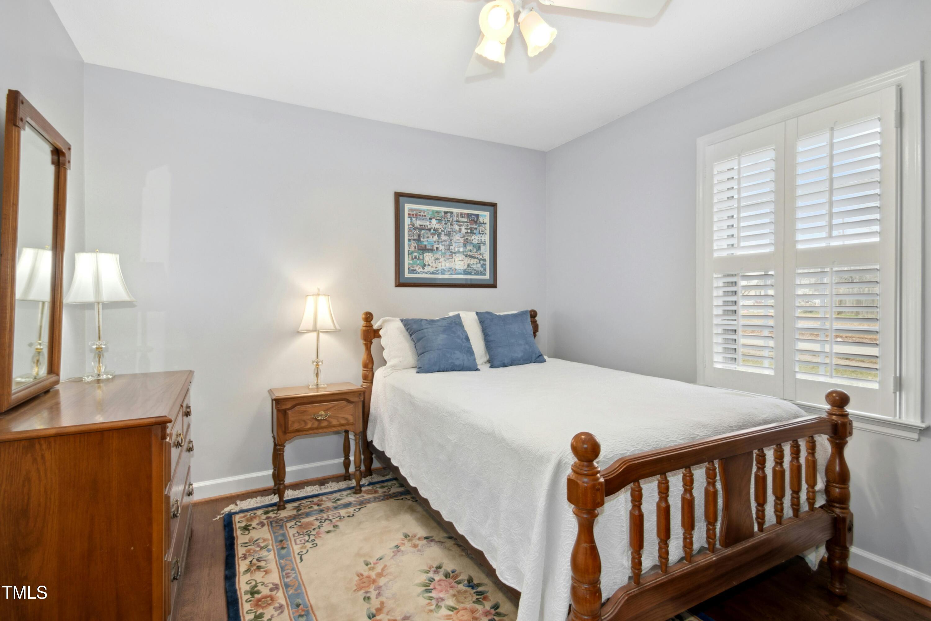 5405 Fireside Drive Raleigh, NC 27609 - Photo 13 of 29 a bedroom with a bed and a window