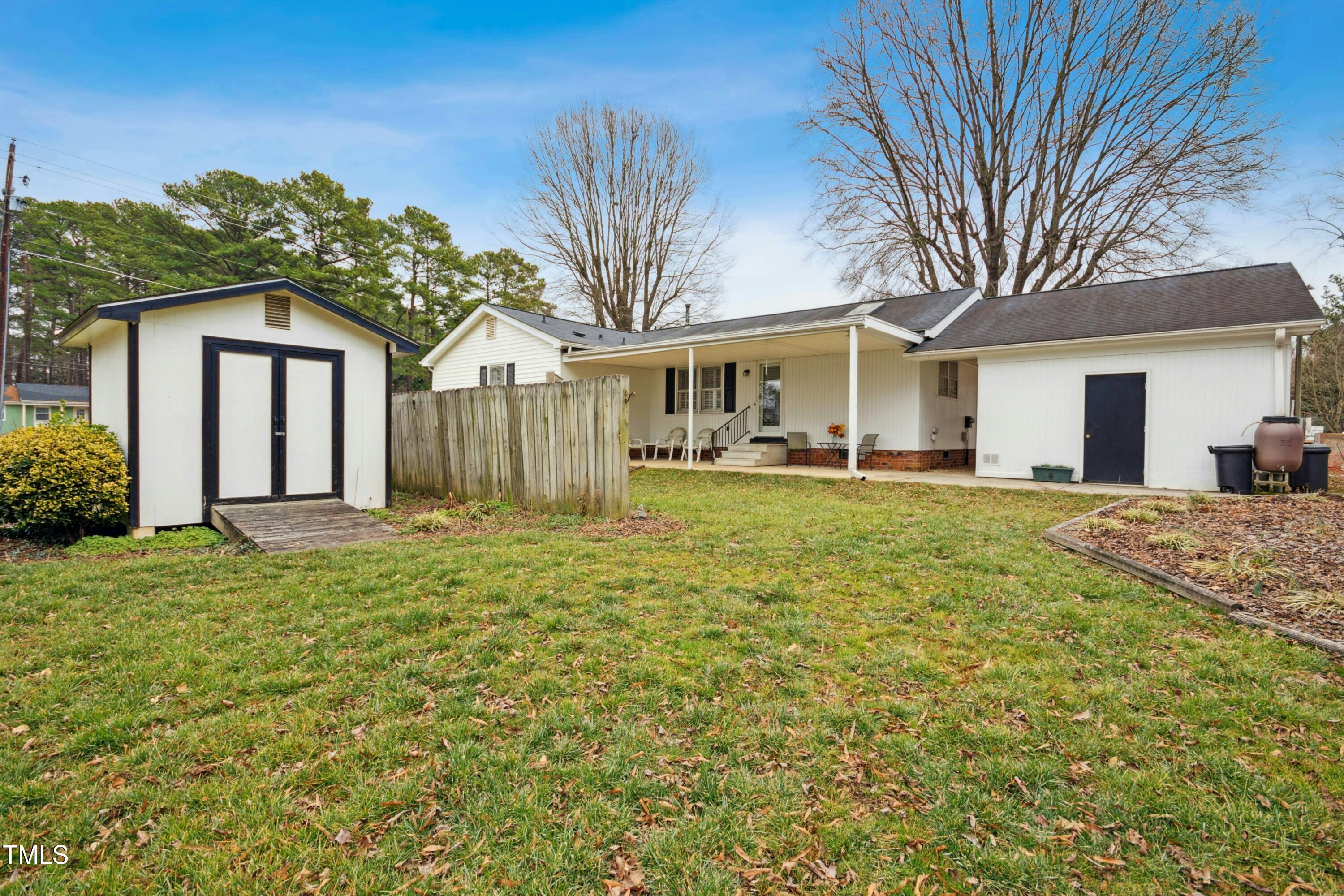 5405 Fireside Drive Raleigh, NC 27609 - Photo 24 of 29 a front view of a house with a garden