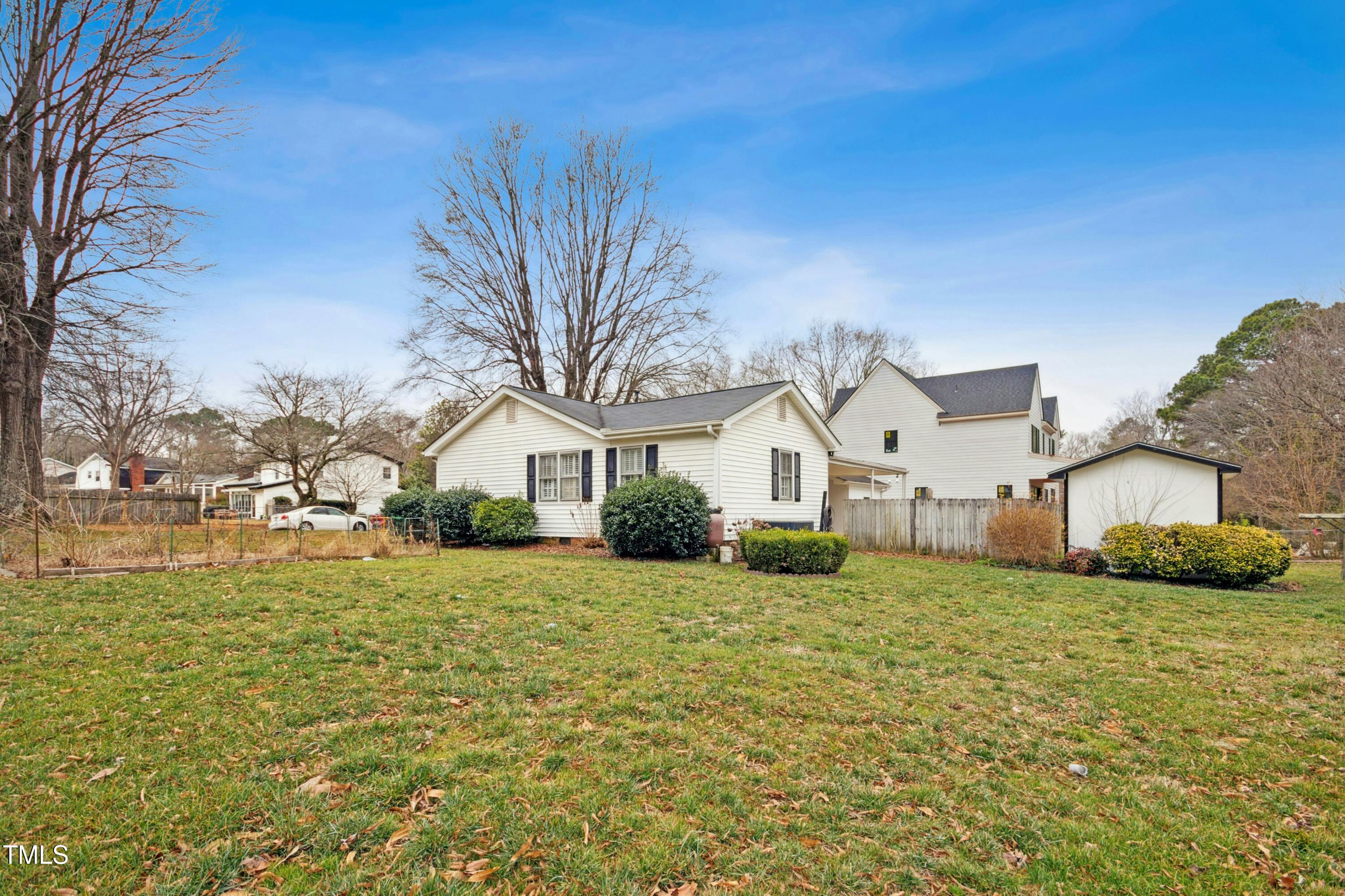 5405 Fireside Drive Raleigh, NC 27609 - Photo 26 of 29 a front view of a house with a yard