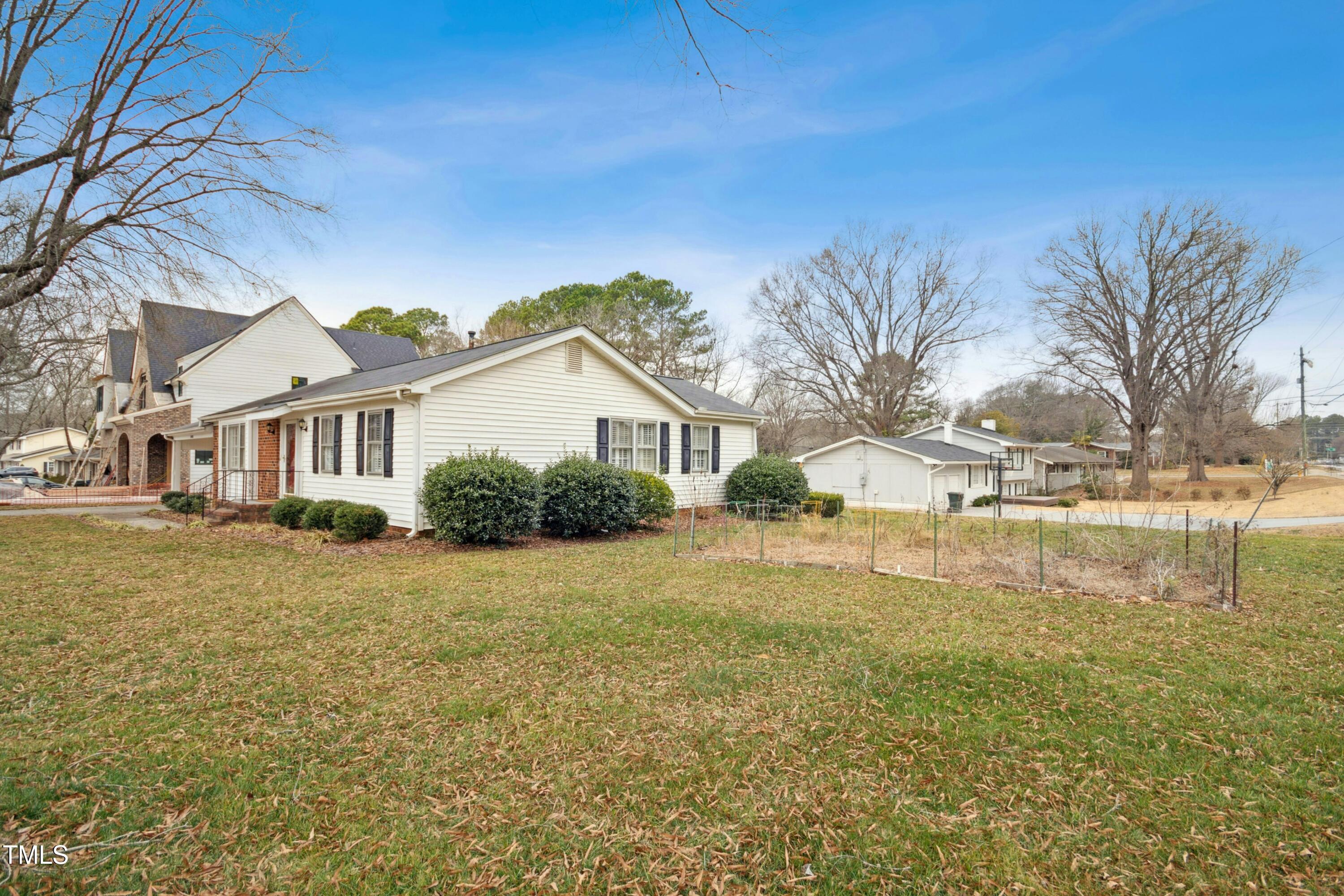 5405 Fireside Drive Raleigh, NC 27609 - Photo 27 of 29 a front view of a house with a yard