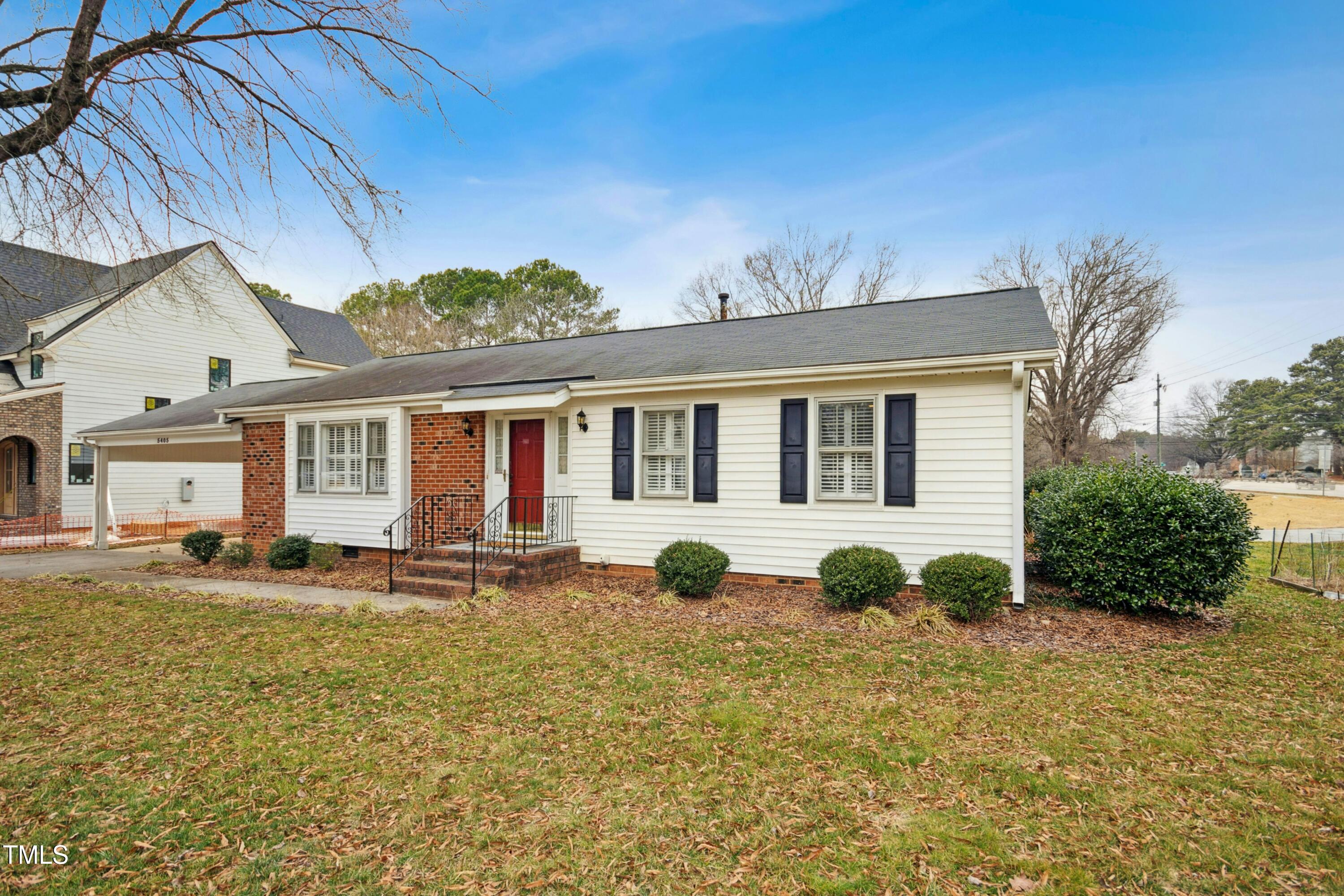 5405 Fireside Drive Raleigh, NC 27609 - Photo 3 of 29 a front view of a house with garden