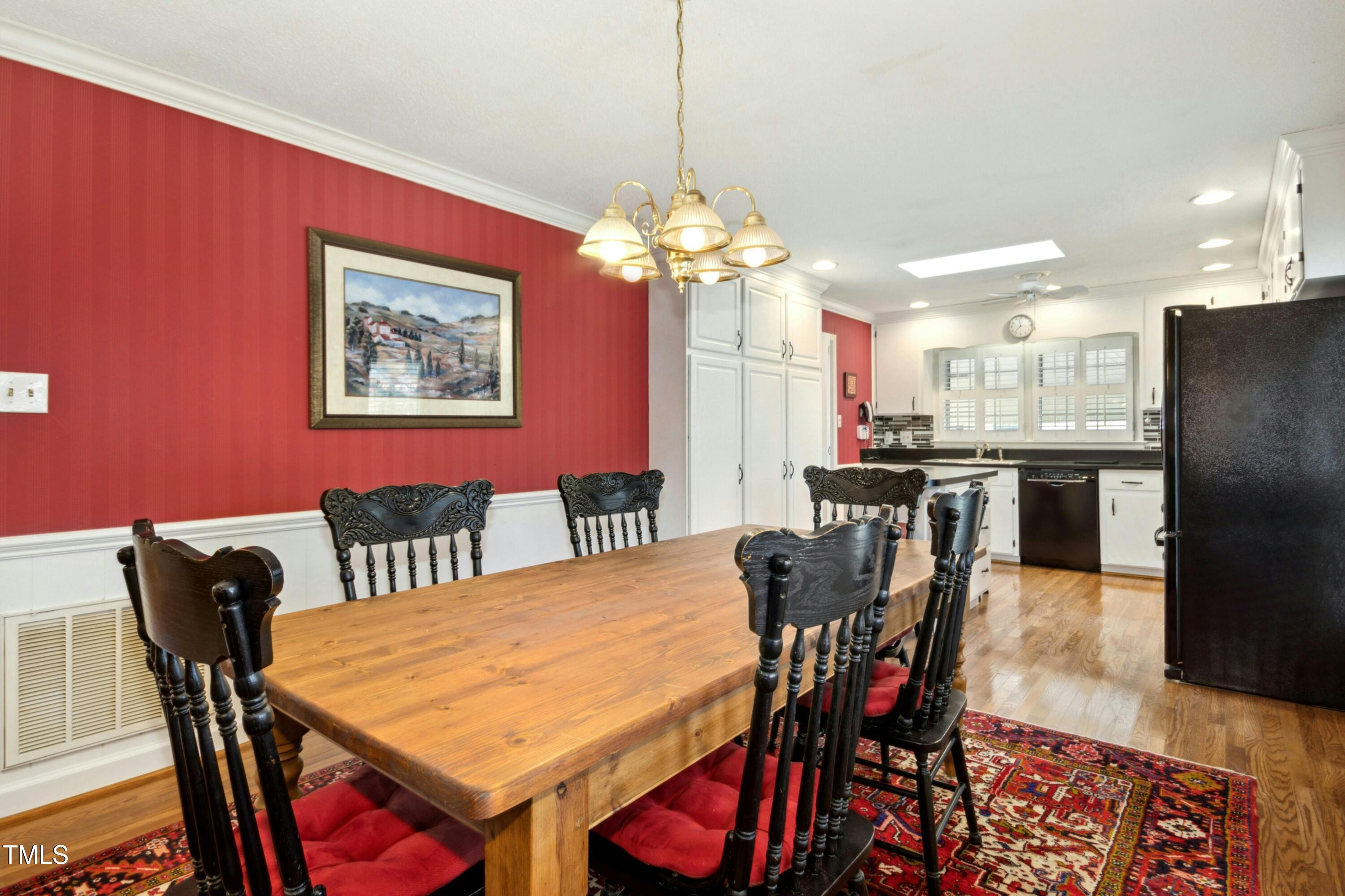 5405 Fireside Drive Raleigh, NC 27609 - Photo 7 of 29 a view of a dining room with furniture