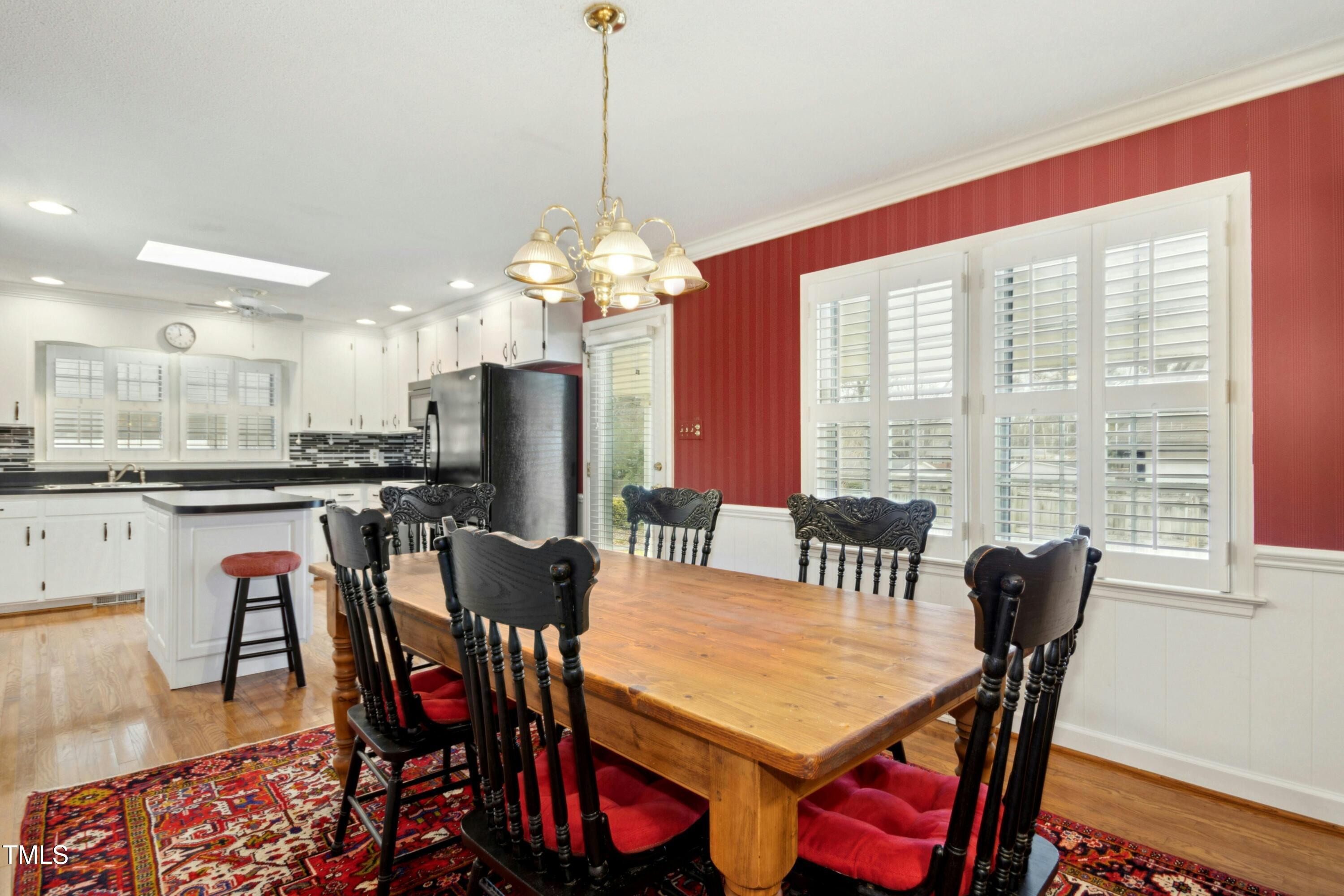5405 Fireside Drive Raleigh, NC 27609 - Photo 8 of 29 a view of a dining room with furniture window and outside view