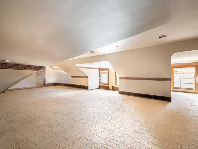 a view of empty room with windows