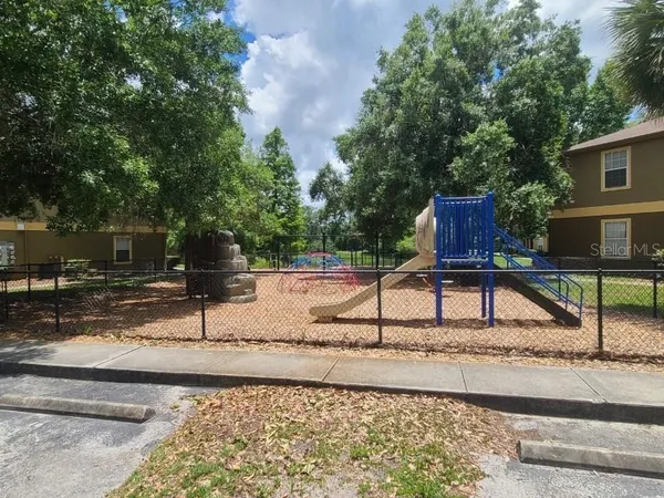 a view of a swimming pool with a yard
