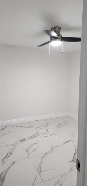 900 Southwest 11th Street, Unit 3 Hallandale Beach, FL 33009 - Photo 12 of 14 a view of a room with racks on the wall