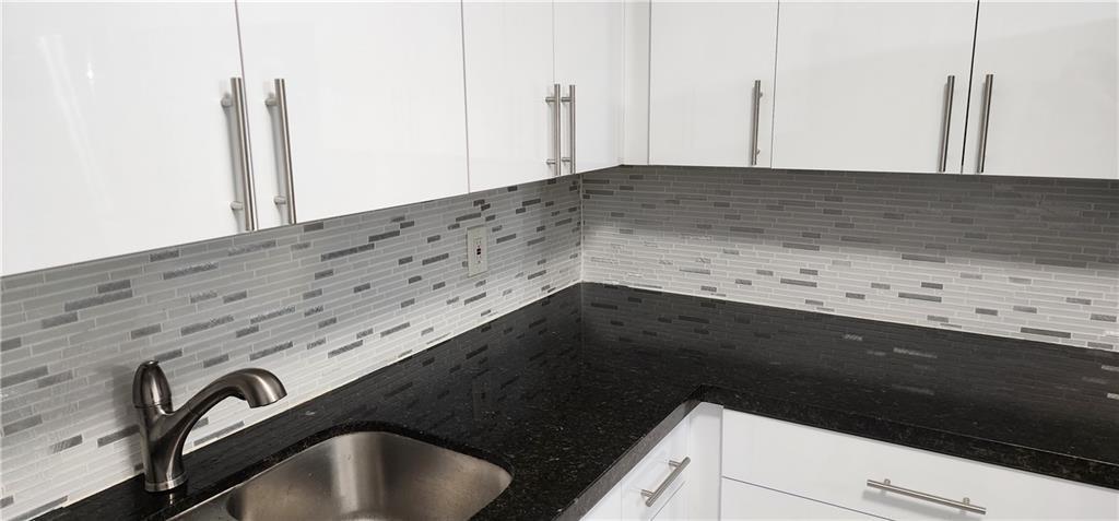 900 Southwest 11th Street, Unit 3 Hallandale Beach, FL 33009 - Photo 2 of 14 a close view of sink and tap