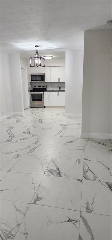 900 Southwest 11th Street, Unit 3 Hallandale Beach, FL 33009 - Photo 4 of 14 a view of storage and utility room