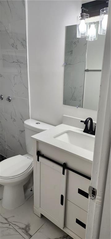 900 Southwest 11th Street, Unit 3 Hallandale Beach, FL 33009 - Photo 6 of 14 a bathroom with a sink a toilet and shower