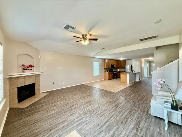 a living room with furniture and a fireplace