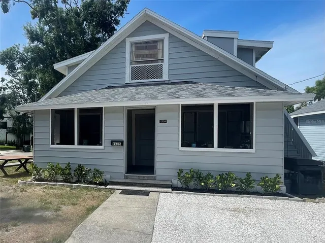 a front view of a house with yard
