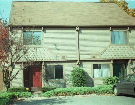 46 Strathmore Lane, Unit 46 Norwalk, CT 06880 - Photo 1 of 1 a front view of a house with garden