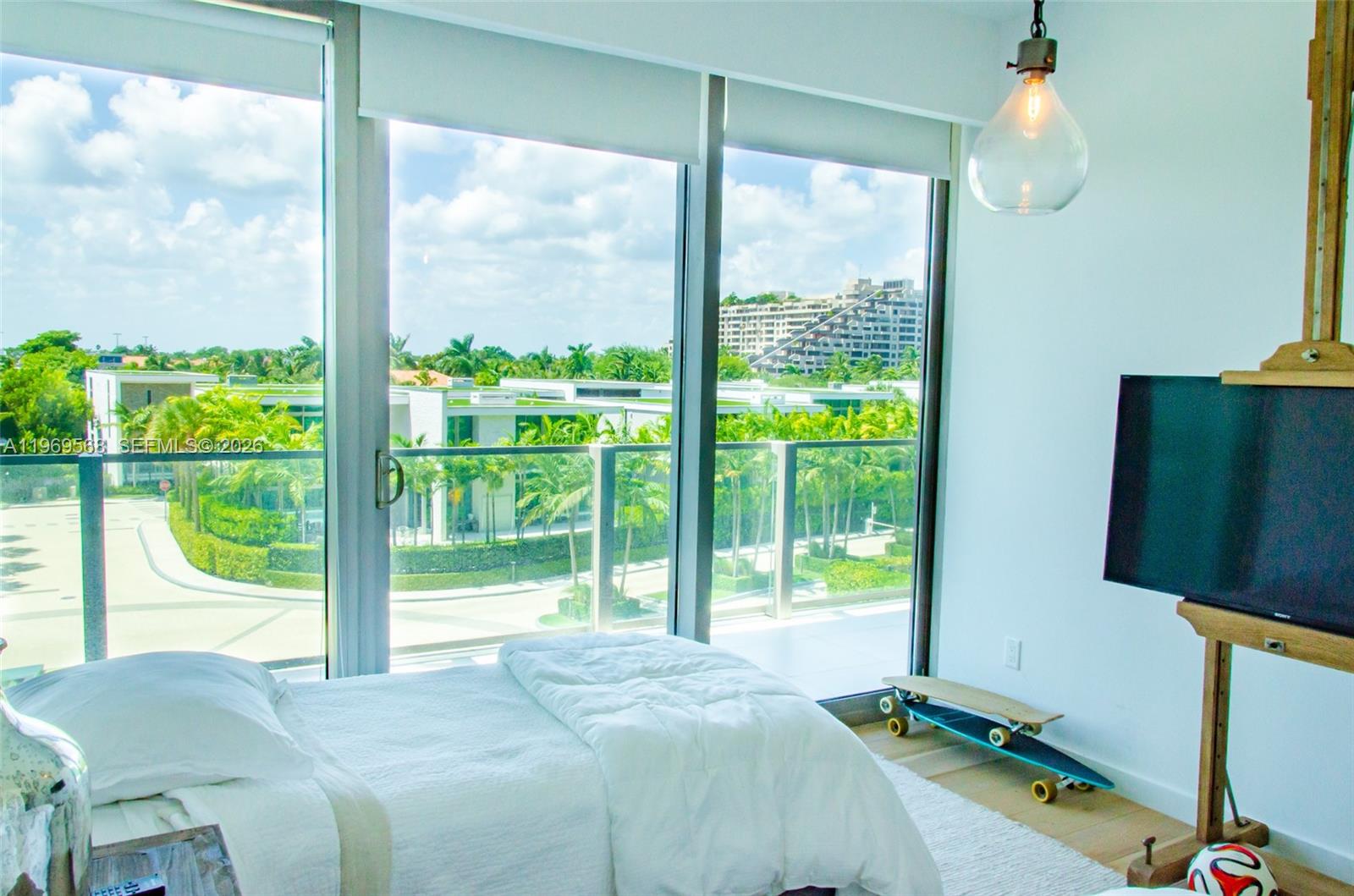350 Ocean Drive, Unit 406N Key Biscayne, FL 33149 - Photo 28 of 41 a bedroom with a bed and large window