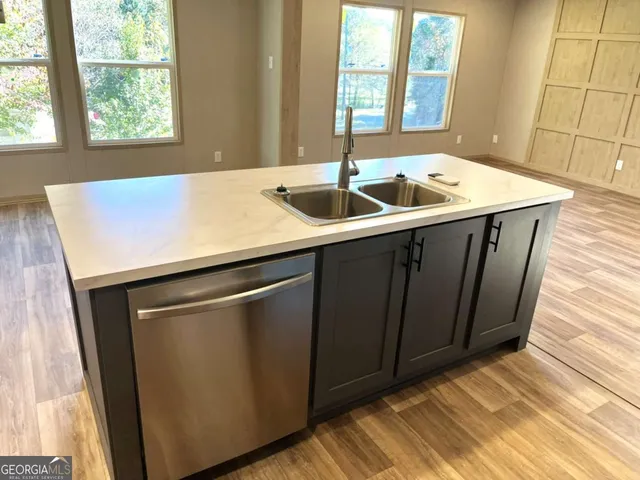 a kitchen with a sink and a window