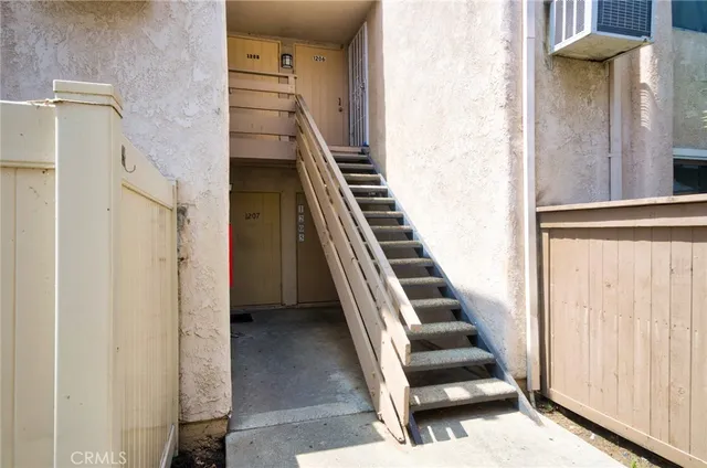a view of a staircase with white walls