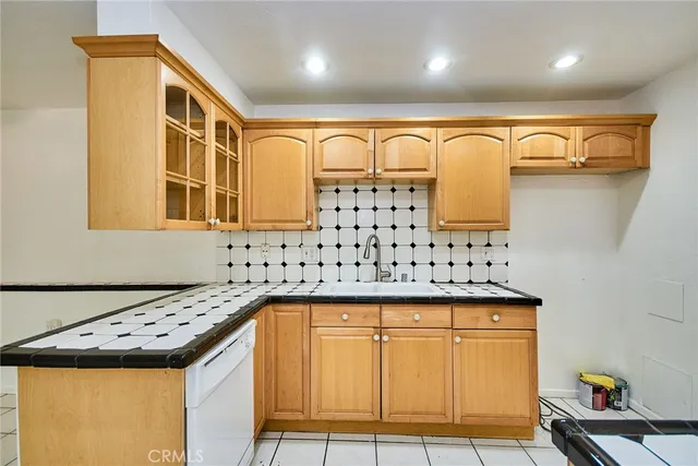 a bathroom with a sink a mirror and shower