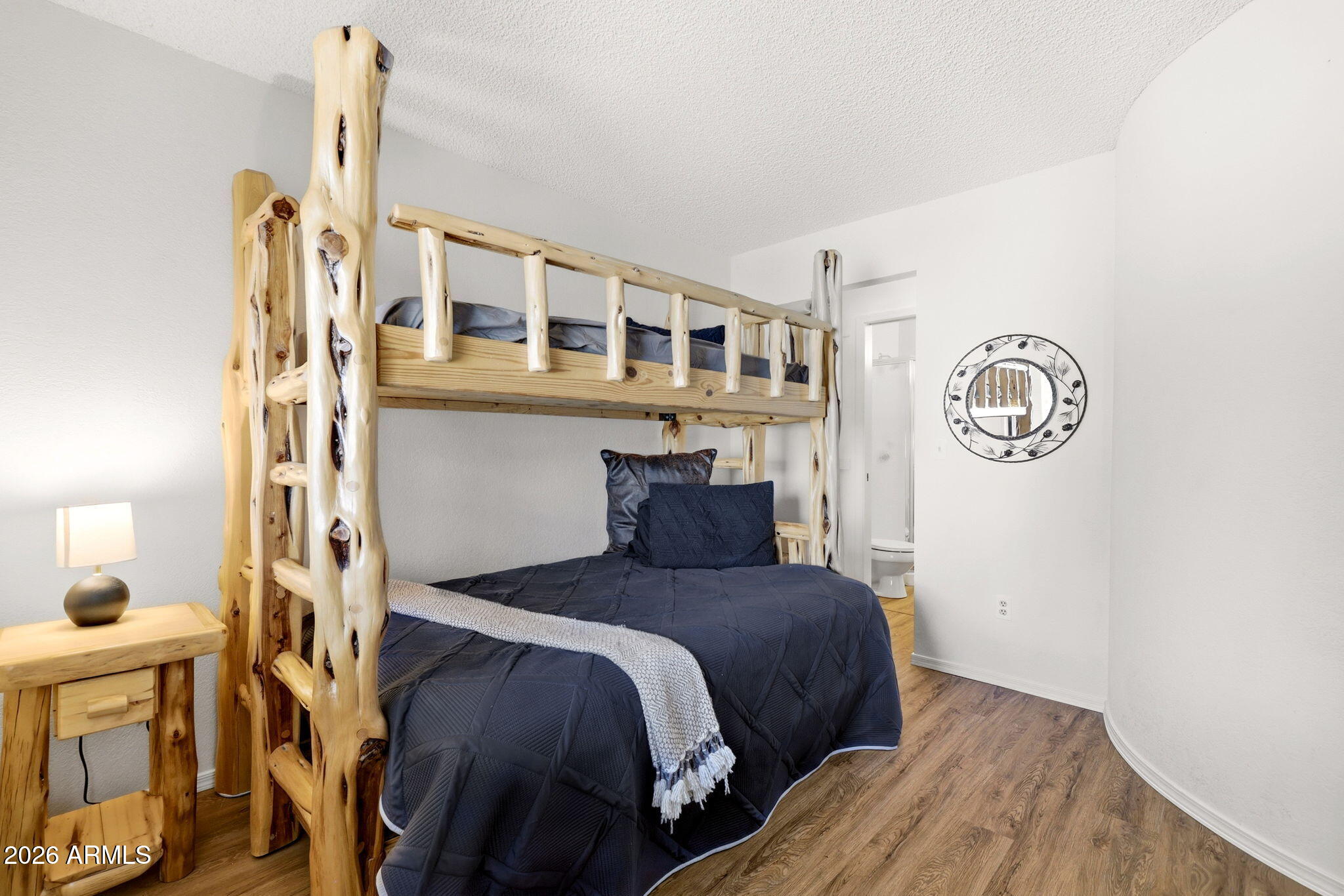 2700 South White Mountain Road, Unit 1025 Show Low, AZ 85901 - Photo 9 of 29 a bedroom with a bed and a table in it