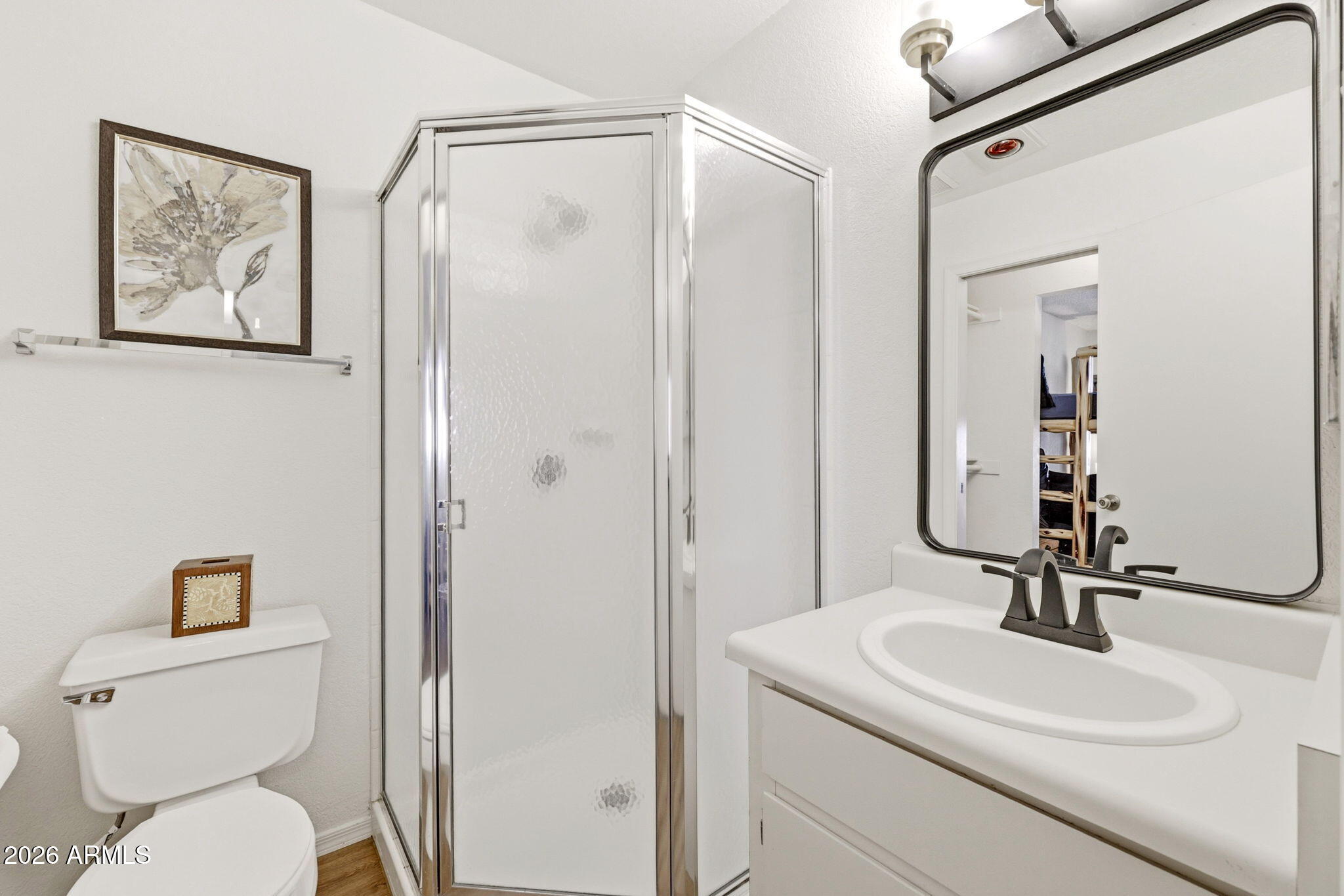 2700 South White Mountain Road, Unit 1025 Show Low, AZ 85901 - Photo 10 of 29 a bathroom with a toilet a sink and mirror