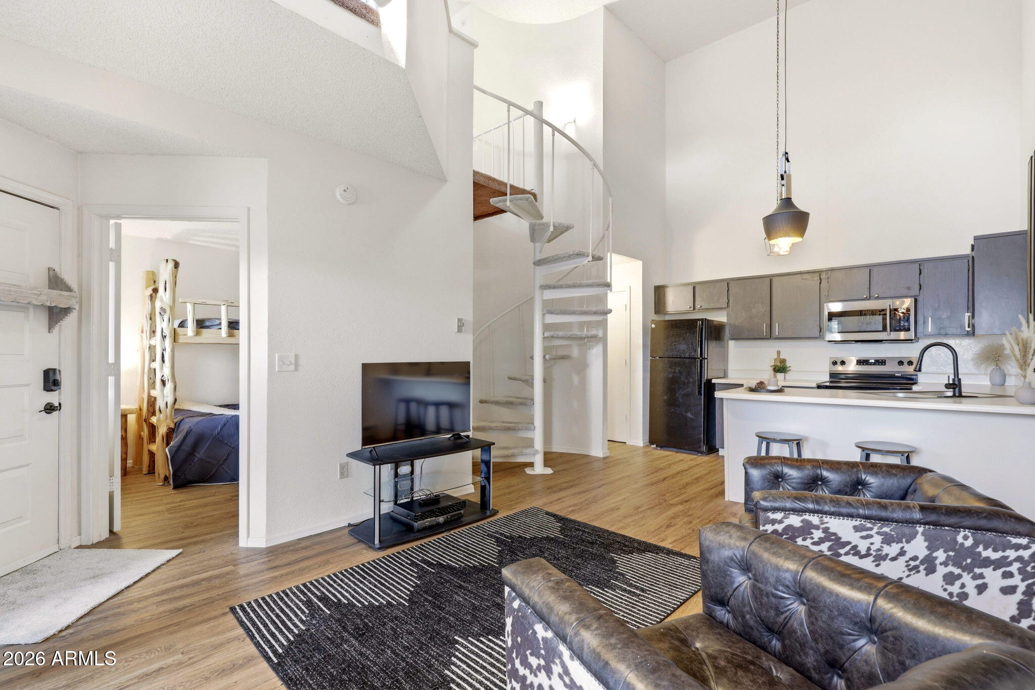 2700 South White Mountain Road, Unit 1025 Show Low, AZ 85901 - Photo 11 of 29 a living room with stainless steel appliances furniture a rug and a view of kitchen