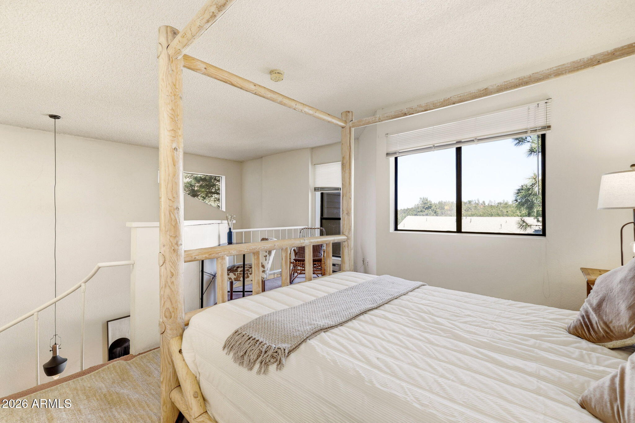 2700 South White Mountain Road, Unit 1025 Show Low, AZ 85901 - Photo 14 of 29 a bedroom with a bed and a window