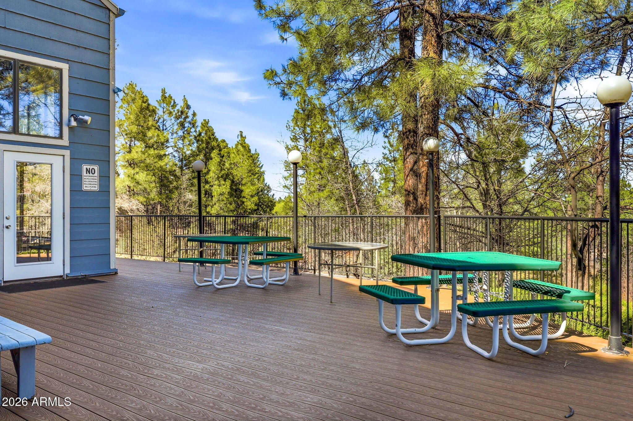 2700 South White Mountain Road, Unit 1025 Show Low, AZ 85901 - Photo 20 of 29 a view of a chairs and table on the wooden deck