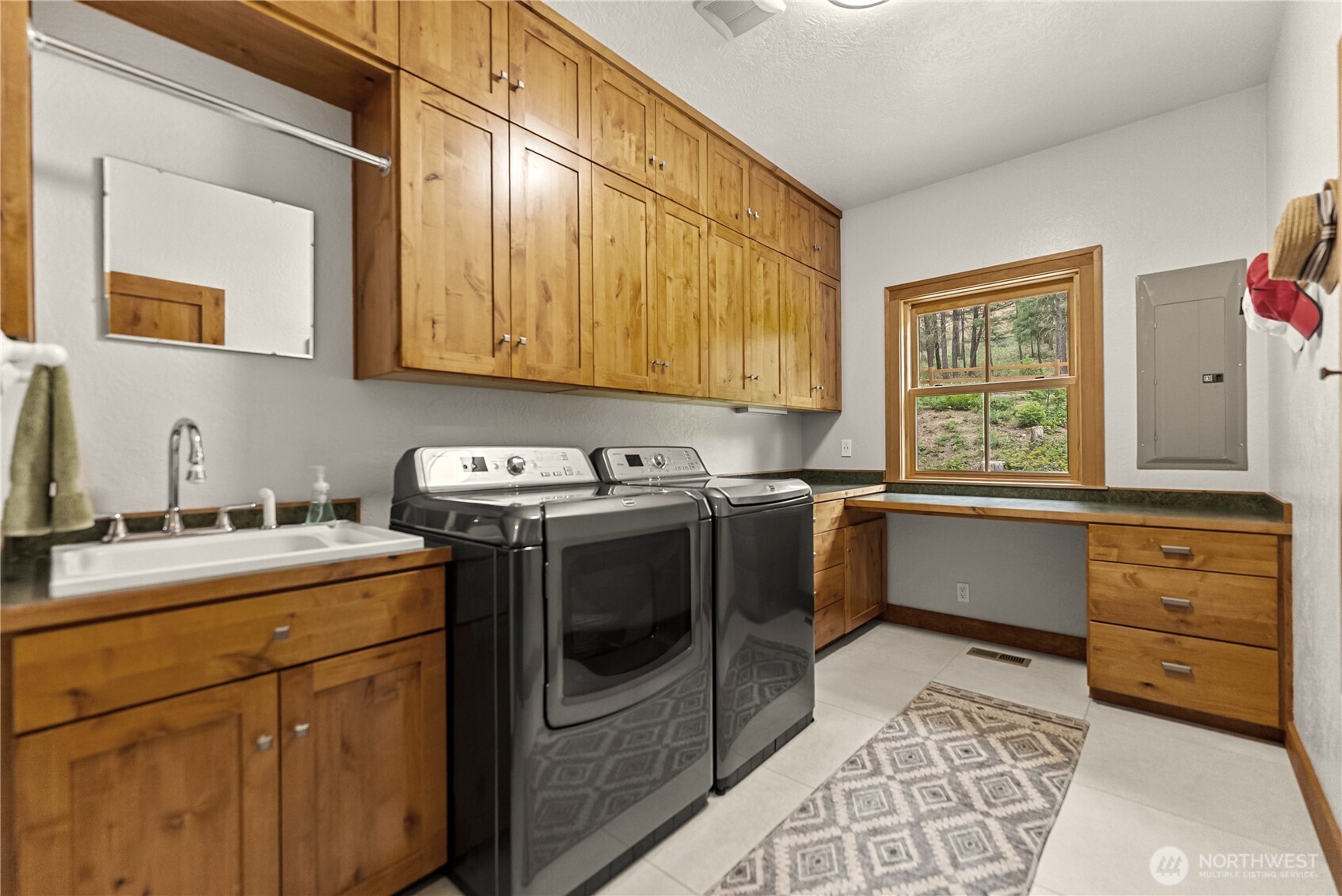 201 Libby Creek Road Carlton, WA 98814 - Photo 22 of 37 a kitchen with a stove sink and cabinets