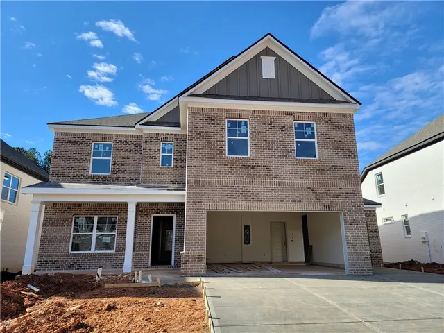 a front view of a house with yard