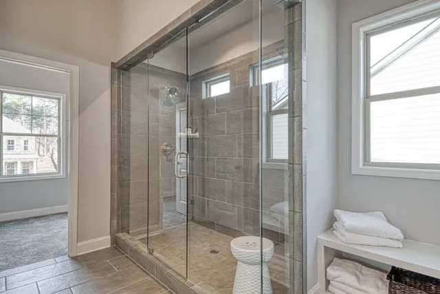 a bathroom with a shower and toilet