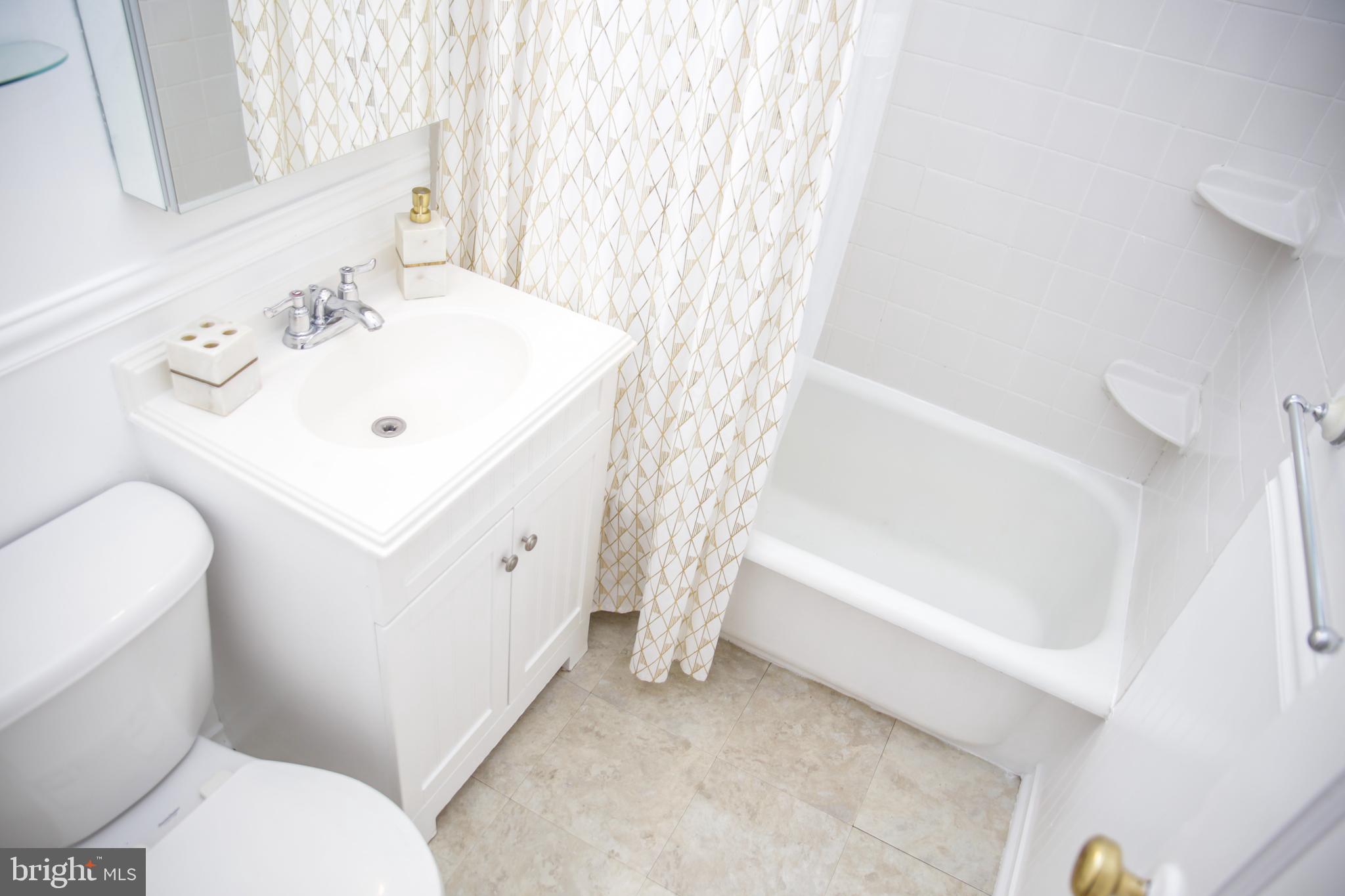 51 Ridge Road, Unit C Greenbelt, MD 20770 - Photo 12 of 27 Clean, neutral bath